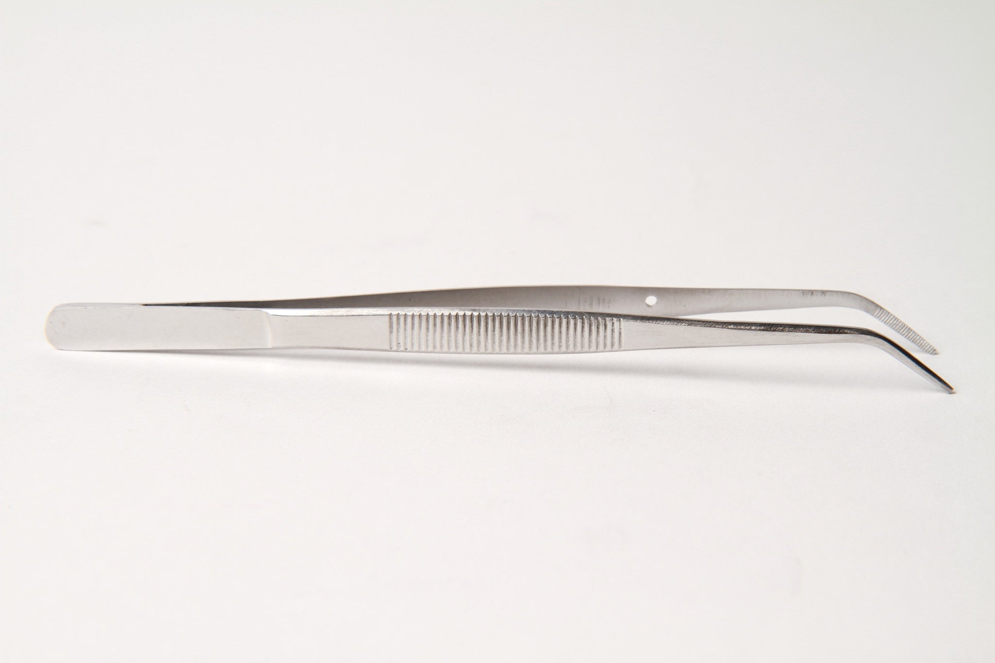 Tweezers for Sewing. Steel Bent Tweezers Isolated on White